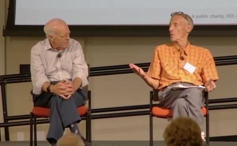 Alan Weissberger (right) puts a question to John Hennessy during their conversation at Santa Clara University, October 8, 2025. Still from the IEEE Silicon Valley History Videos recording.