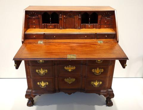 An antique writing desk — the post traces how technology reshaped the desk.