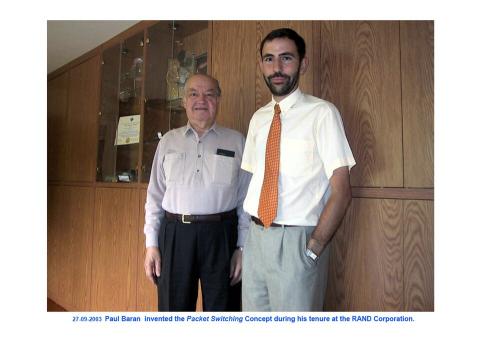 Paul Baran (left), a pioneer of packet switching, at the RAND Corporation.