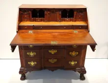 An antique writing desk — the post traces how technology reshaped the desk.