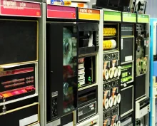 Digital Equipment Corporation minicomputers — a PDP-11, a PDP-8e, and a PDP-12 — on display in a museum.