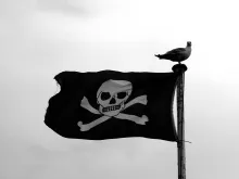 A Jolly Roger flag — evoking The Pirate Bay file-sharing case.