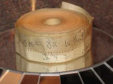 Punched paper tape, an early way of entering programs.